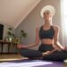 Young woman performing yoga at home on yoga mat